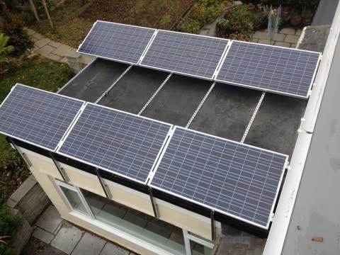 A flat-roof mounted solar PV and micro inverter installation