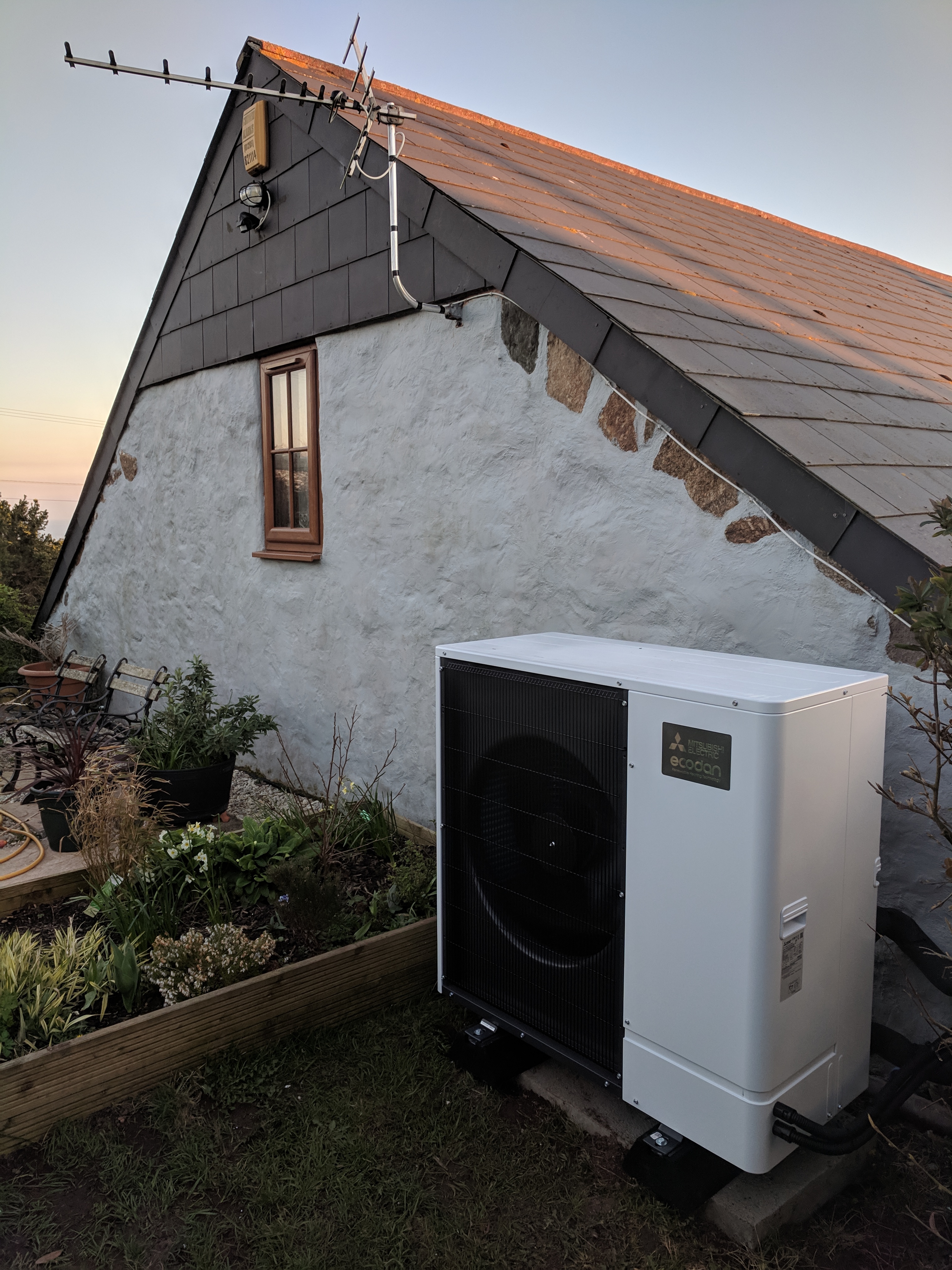 An 11.2kW Ultra Quiet Mitsubishi Ecodan air source heat pump installed by GreenGenUK.